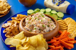 kickoff chip dip in bowl with chips and veggie sticks