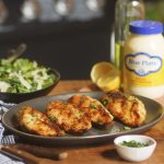 Grilled chicken breasts on a serving platter