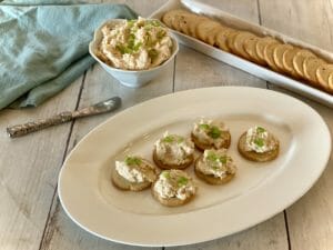 Gulf Coast Shrimp Dip on crackers, arranged on a serving platter