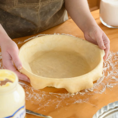 Pie crust made with Blue Plate Mayonnaise, placed in a round pie dish