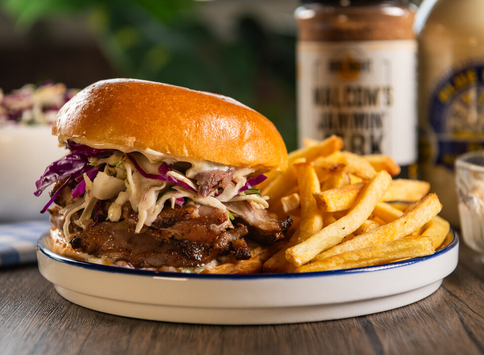 Jammin Jerk Chicken sandwich on brioche roll with fries