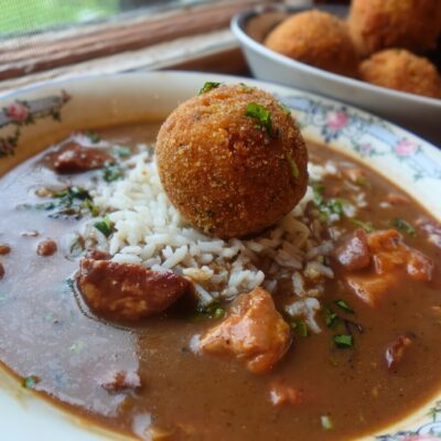 bowl of gumbo with potato salad