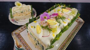 swedish sandwich cake made with egg salad, shrimp salad and cucumber salad for Lent