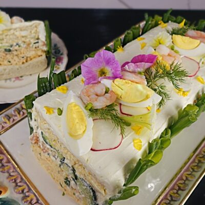 swedish sandwich cake made with egg salad, shrimp salad and cucumber salad for Lent