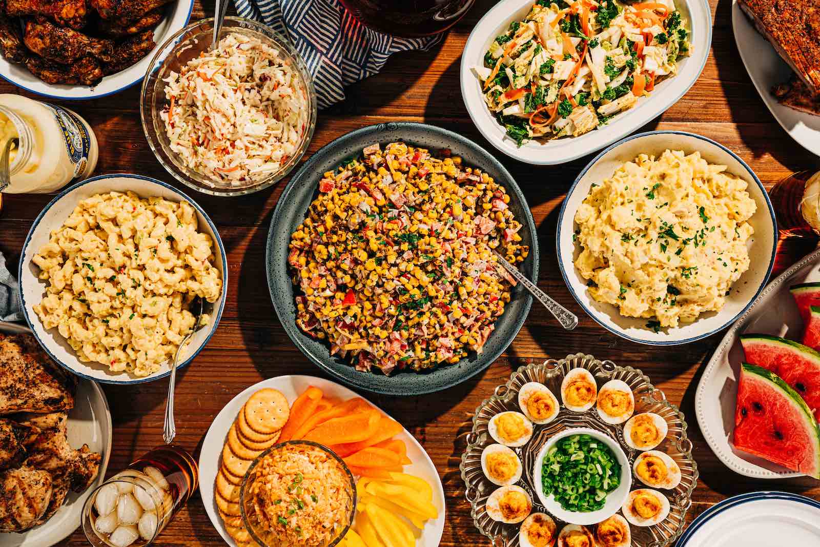 cold side dishes for summer, arranged on a table spread