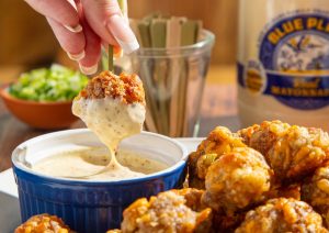 Hot Honey Creole Mustard Dipping Sauce in dish with Sausage Meaballs